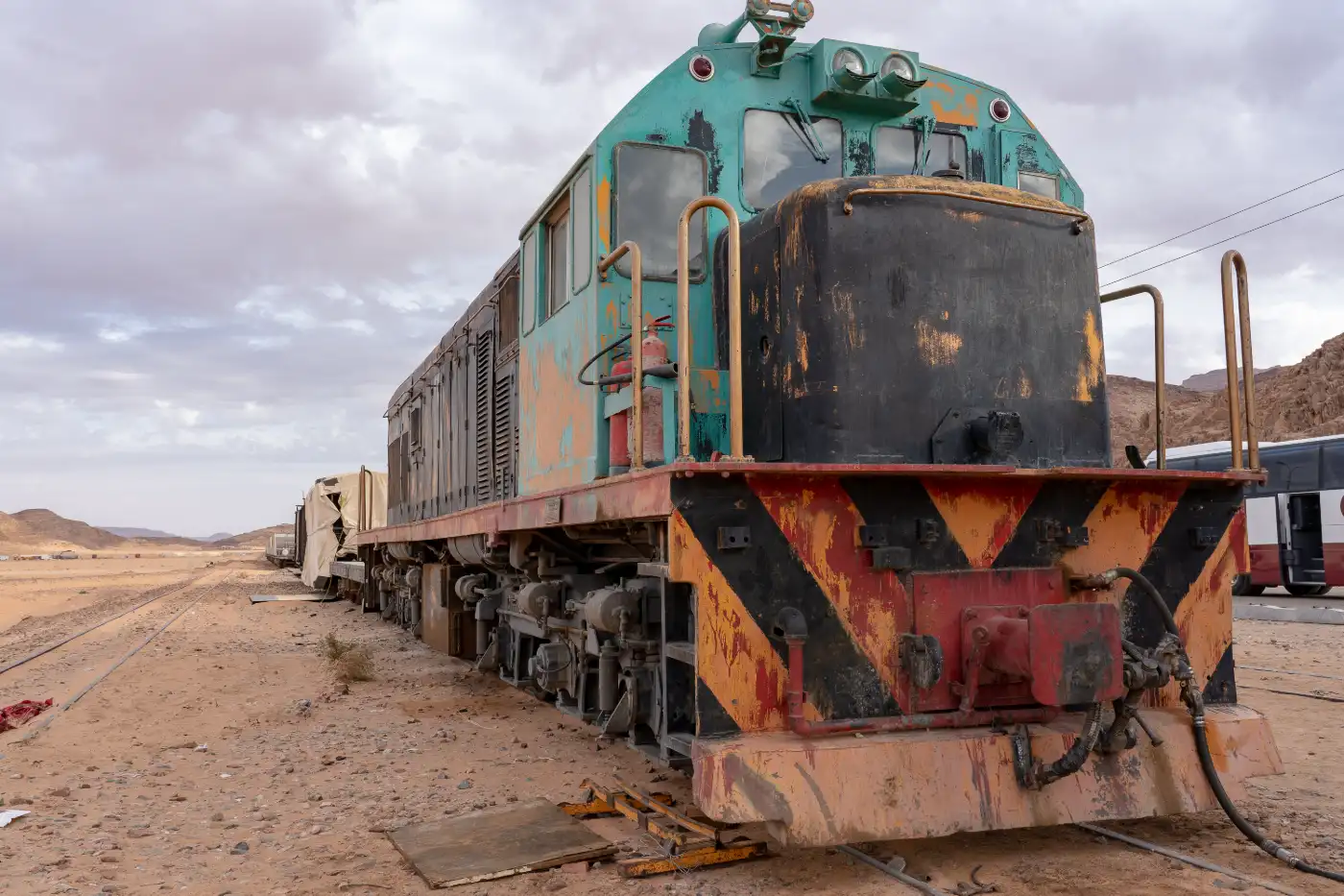 Diesel locomotive standing on tracks in the desert