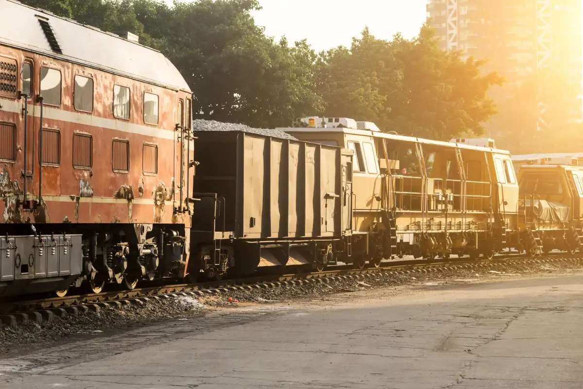 Freight train on the tracks at sunset