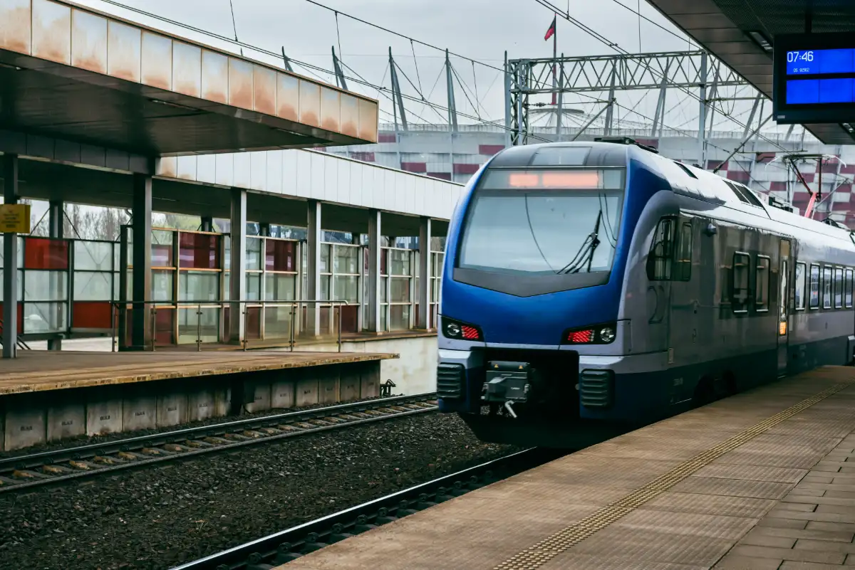 Modern passenger train arriving at a station platform