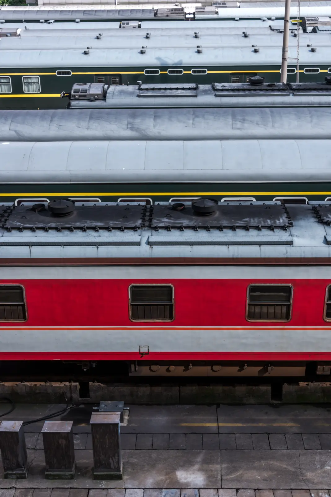 Passenger train standing at a railroad station platform